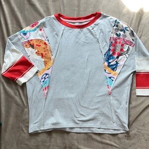 Women’s White Stripe Raglan Tee with Orange Trim and Floral Patchwork